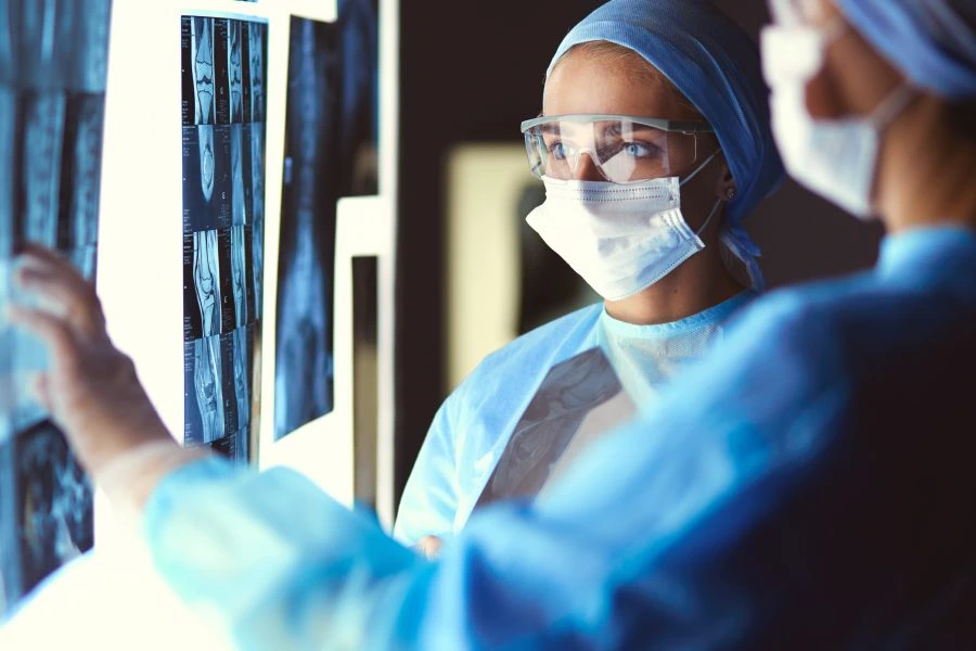 Two doctors checking X-rays